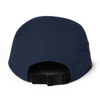 Breck Five Panel Hat back view showing nylon strap clip closure and metal eyelets, Mtns Co official licensed ski resort apparel.