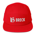 Breck Five Panel Hat in red featuring the Mtns Co Trail Map Logo, a classic style for all ski resort fans.