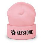 Keystone Beanie from Mtns Co, official licensed ski resort apparel, featuring the bold Keystone logo on a pink cuffed beanie.
