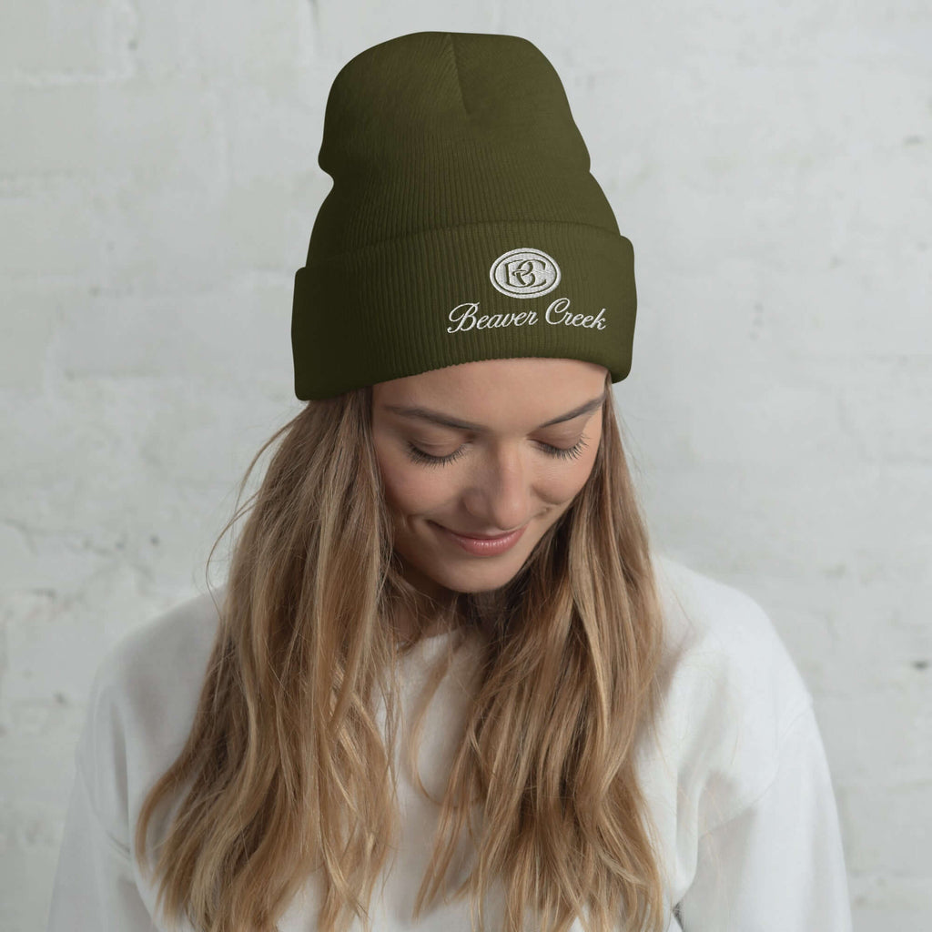 Beaver Creek Beanie in olive green worn by a model, featuring Mtns Co Trail Map Logo, official licensed ski resort apparel.