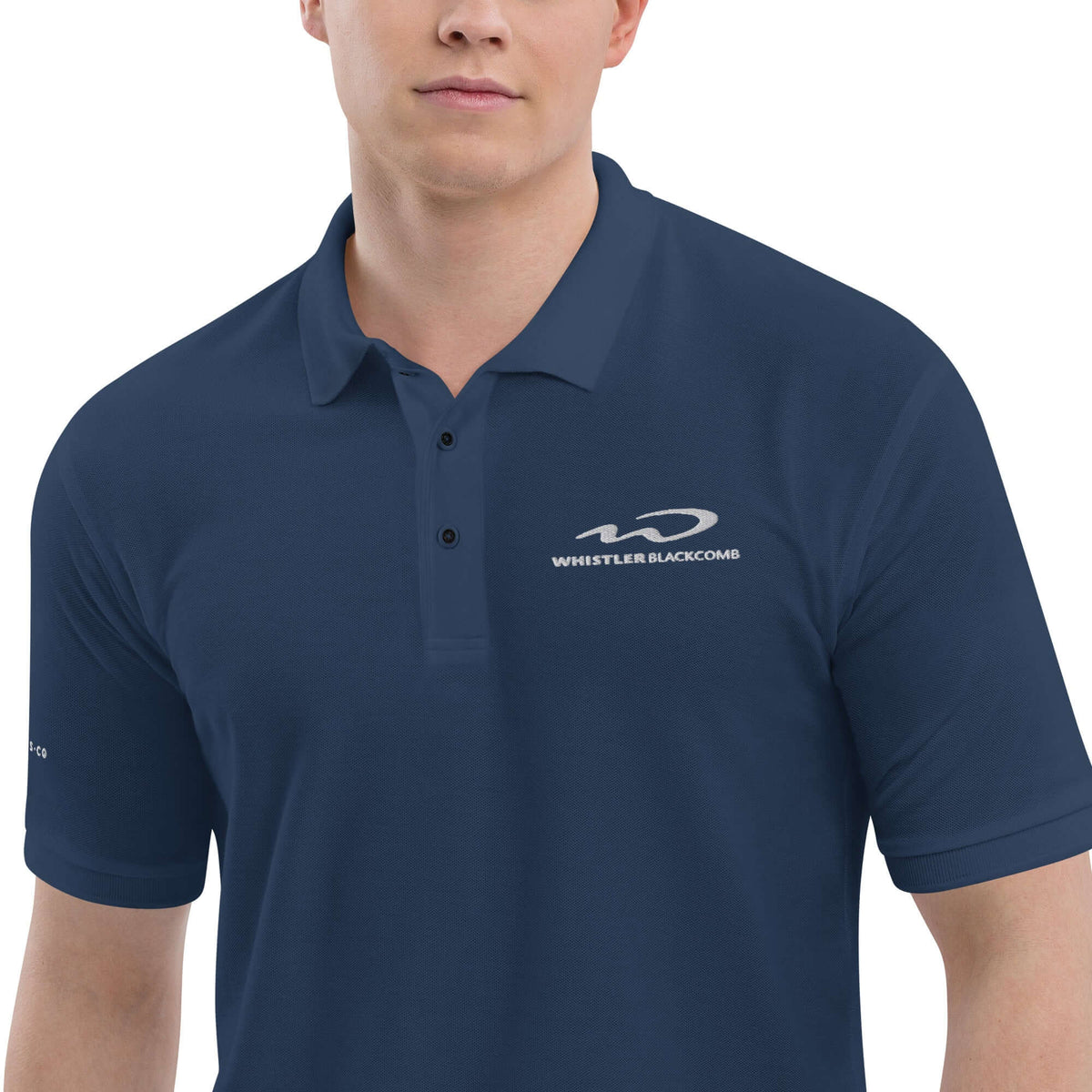 Whistler Blackomb Polo Golf Shirt featuring Mtns Co Trail Map Logo in navy, perfect for official licensed ski resort apparel.