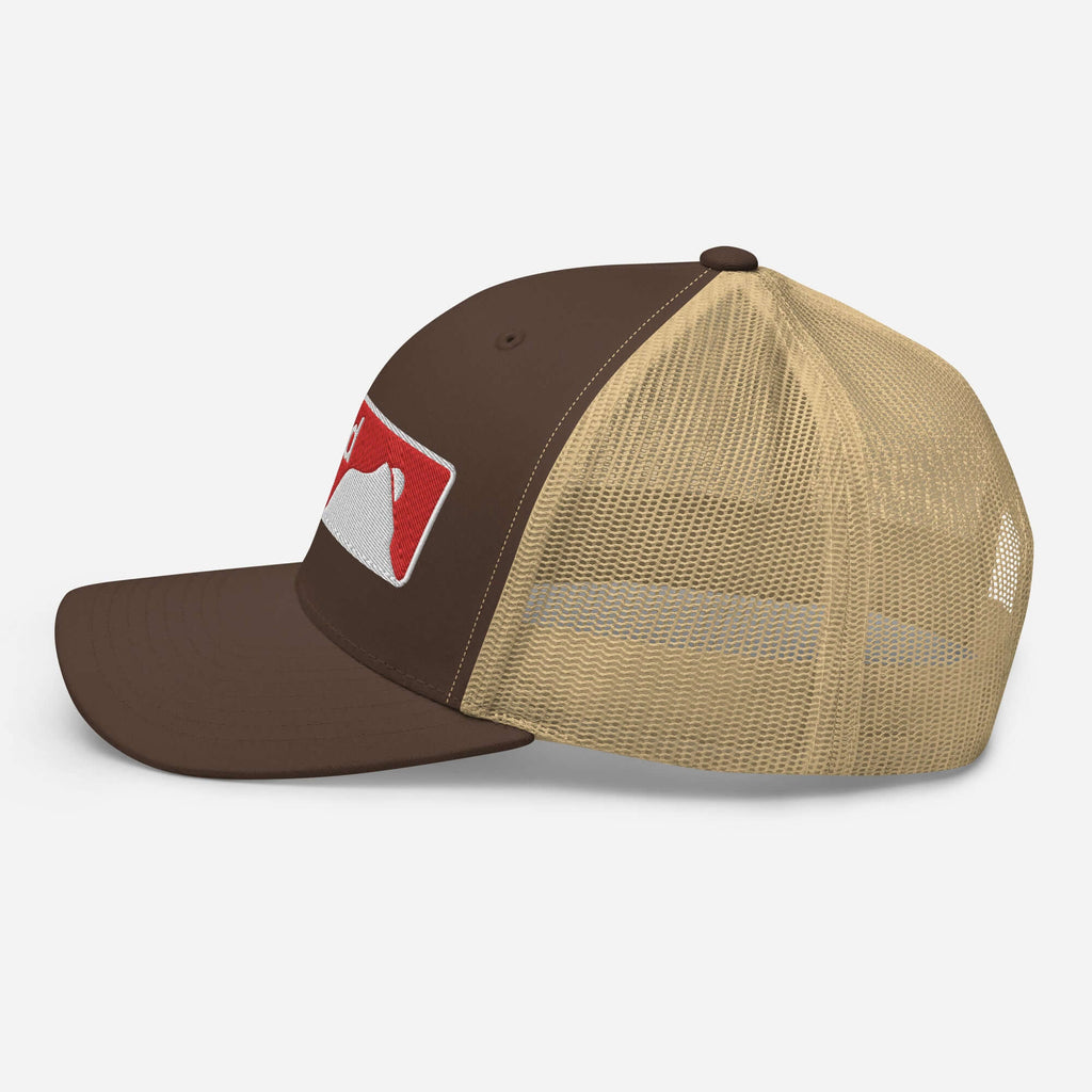 Crested Butte Trucker Hat by Mtns Co with trail map logo, structured six-panel design and breathable mesh back.