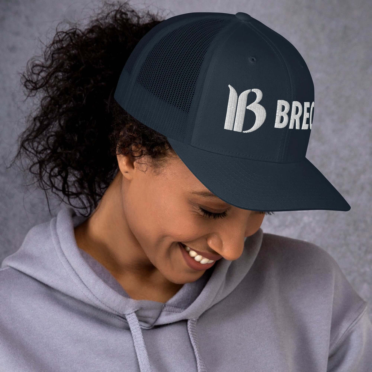 Breckenridge Trucker Hat by Mtns Co featuring trail map logo, structured design, perfect for sunny outdoor adventures.