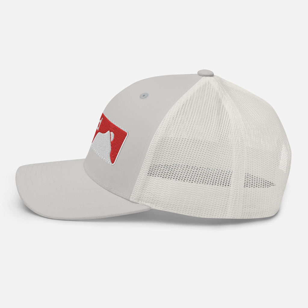 Crested Butte Trucker Hat by Mtns Co with mesh back and trail map logo, perfect for sunny mountain adventures.
