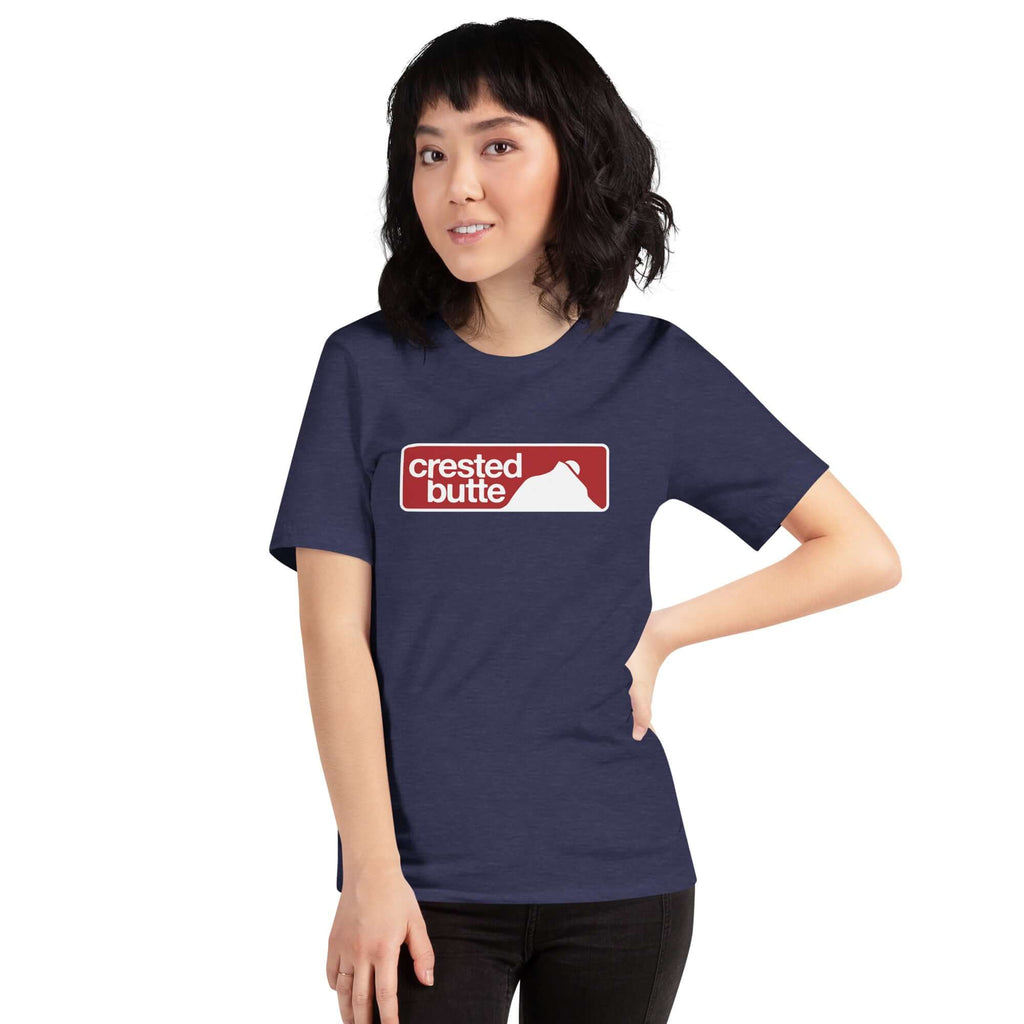 Crested Butte T-Shirt worn by a woman featuring the official Crested Butte Ski Resort logo by Mtns Co.