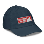 Crested Butte Youth Baseball Cap featuring Mtns Co Trail Map Logo for official licensed ski resort apparel.