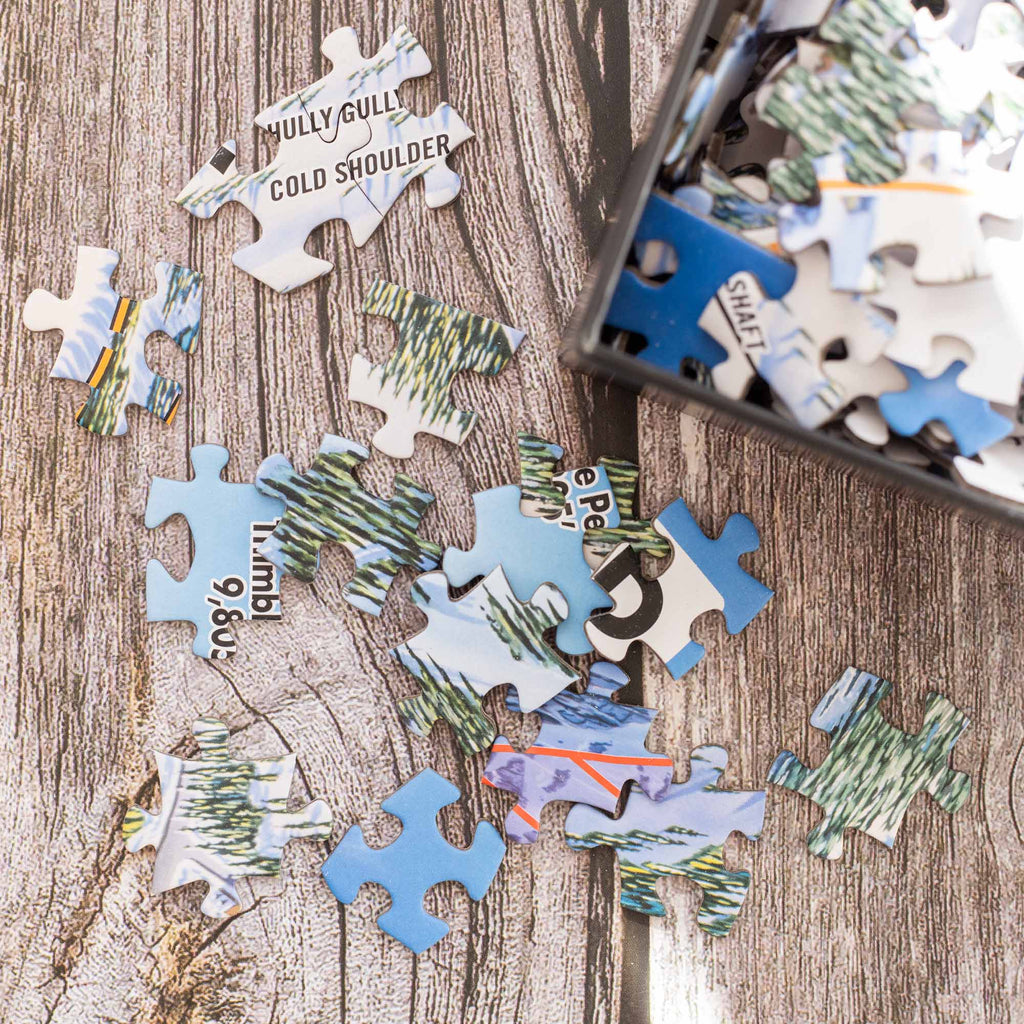 Kirkwood Ski Resort Jigsaw Puzzle – 1000 Pieces puzzle pieces showing trail names, Mtns Co Trail Map Logo.