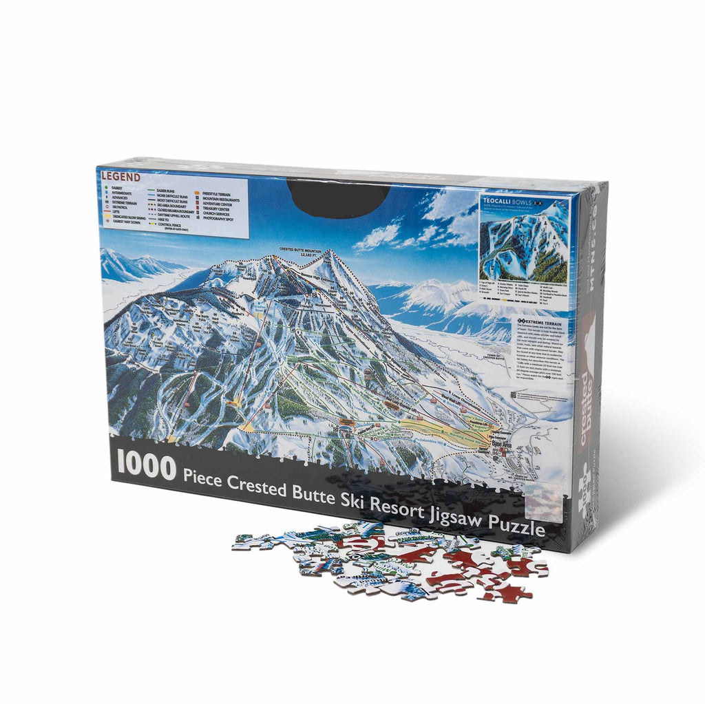 Crested Butte Ski Resort Jigsaw Puzzle – 1000 Pieces by Mtns Co, featuring ski trail map artwork and pieces scattered.