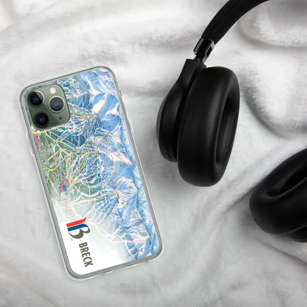 Breckenridge Trail Map iPhone Case featuring the official ski trail map design by Mtns Co on a soft surface with headphones.