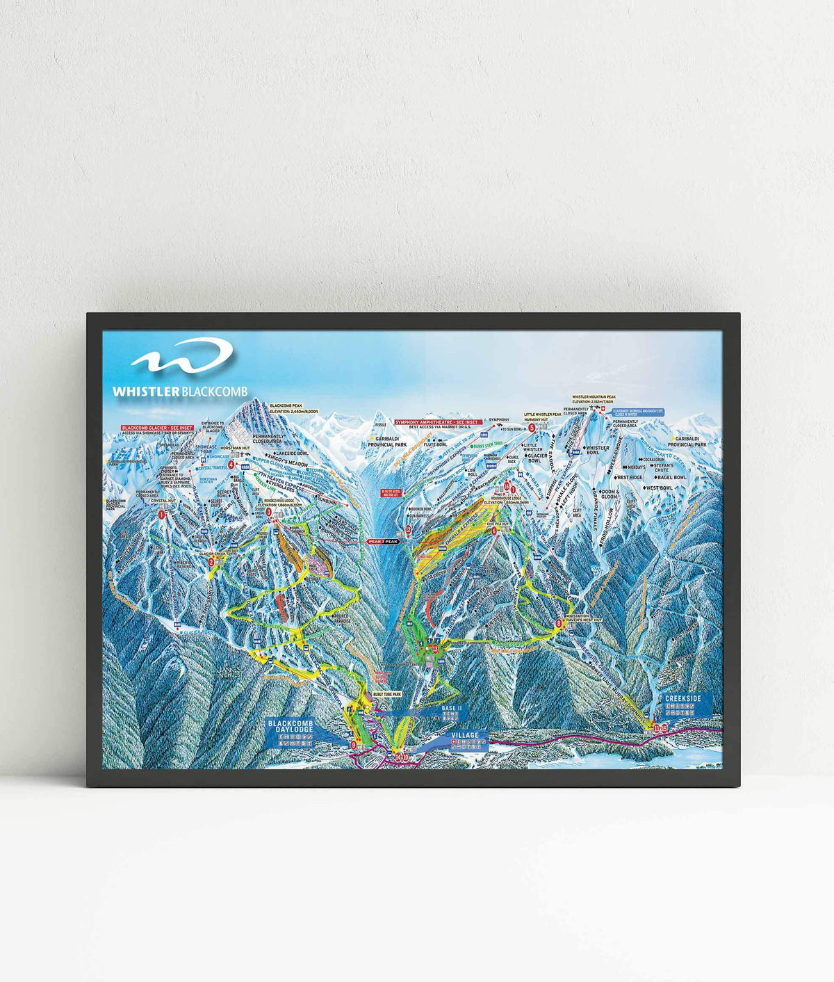 Whistler Blackcomb Ski Resort | Trail Map Poster displayed in a black frame, showcasing ski trails and mountains, by Mtns Co.